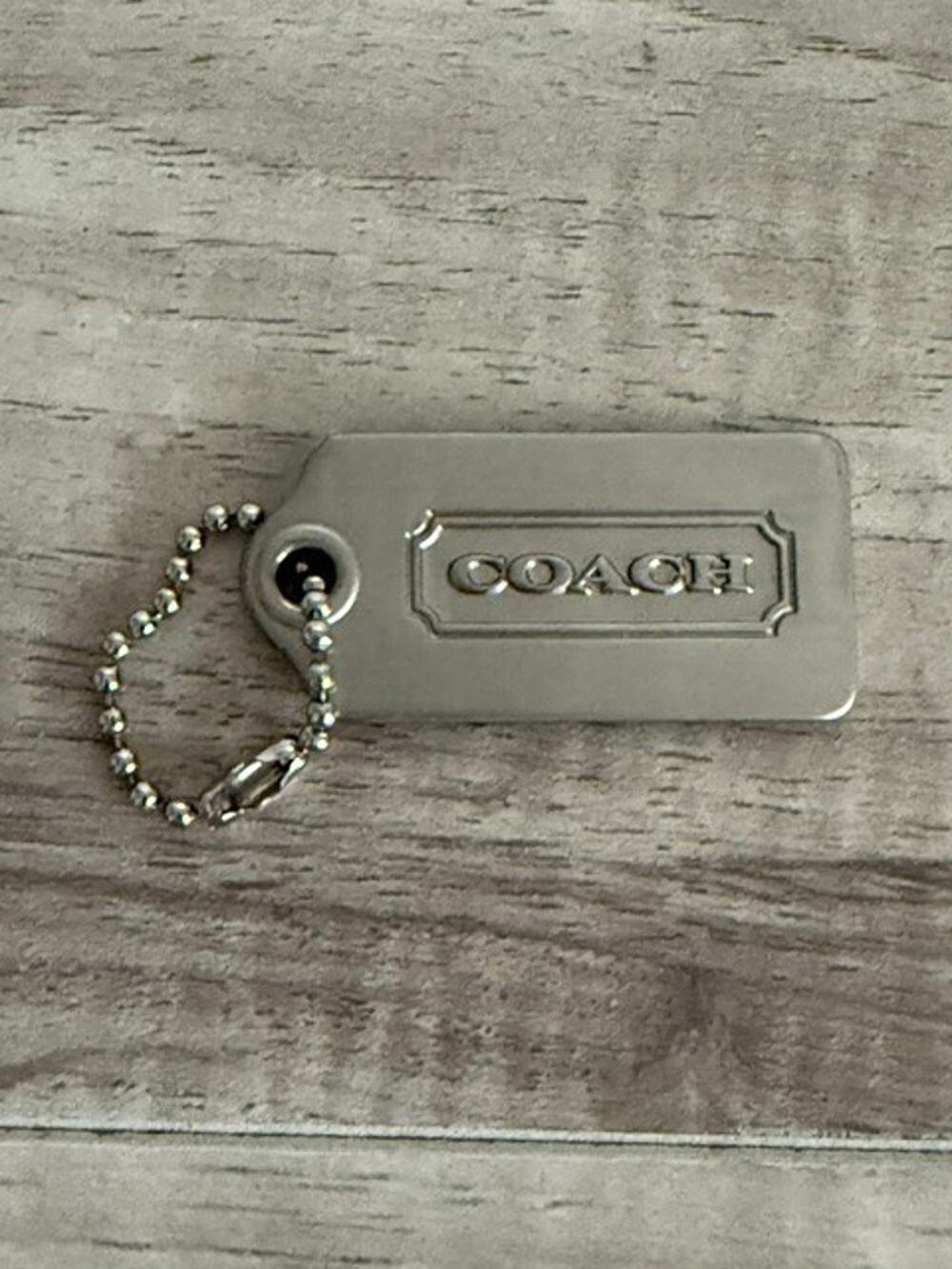 Coach Silver-tone Embossed Logo Hangtag Charm